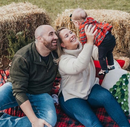 A family picture of Joe, Meghan, and Vienna.